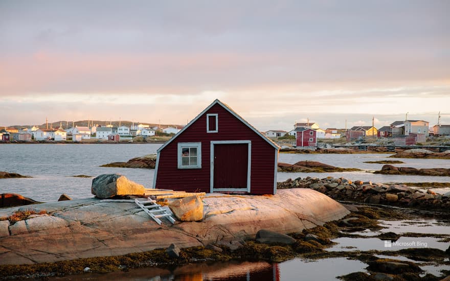 Small red house on the rocky coast of St. John's, Newfoundland and Labrador